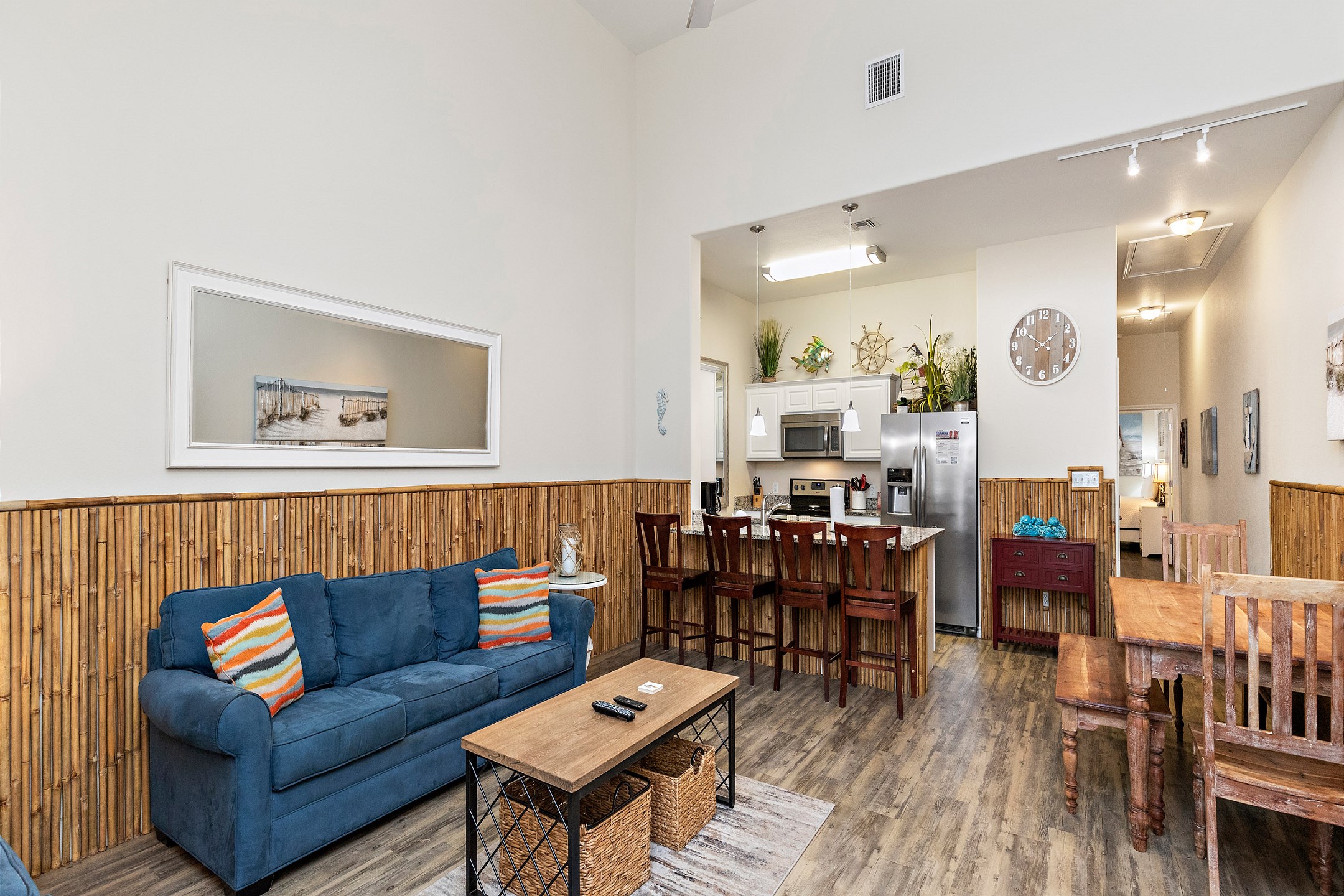 Bright and airy open-concept living space featuring cozy, inviting furniture and stylish coastal-inspired décor, perfect for relaxation and gathering.