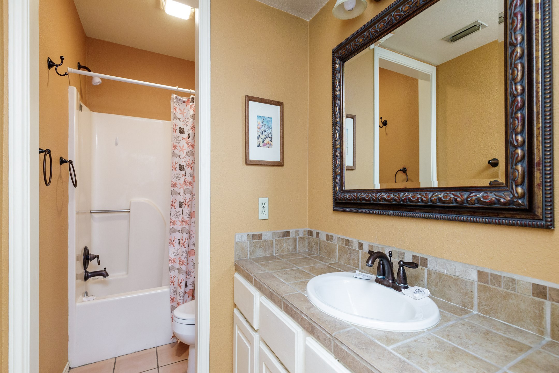 Guest bathroom with tub and shower 