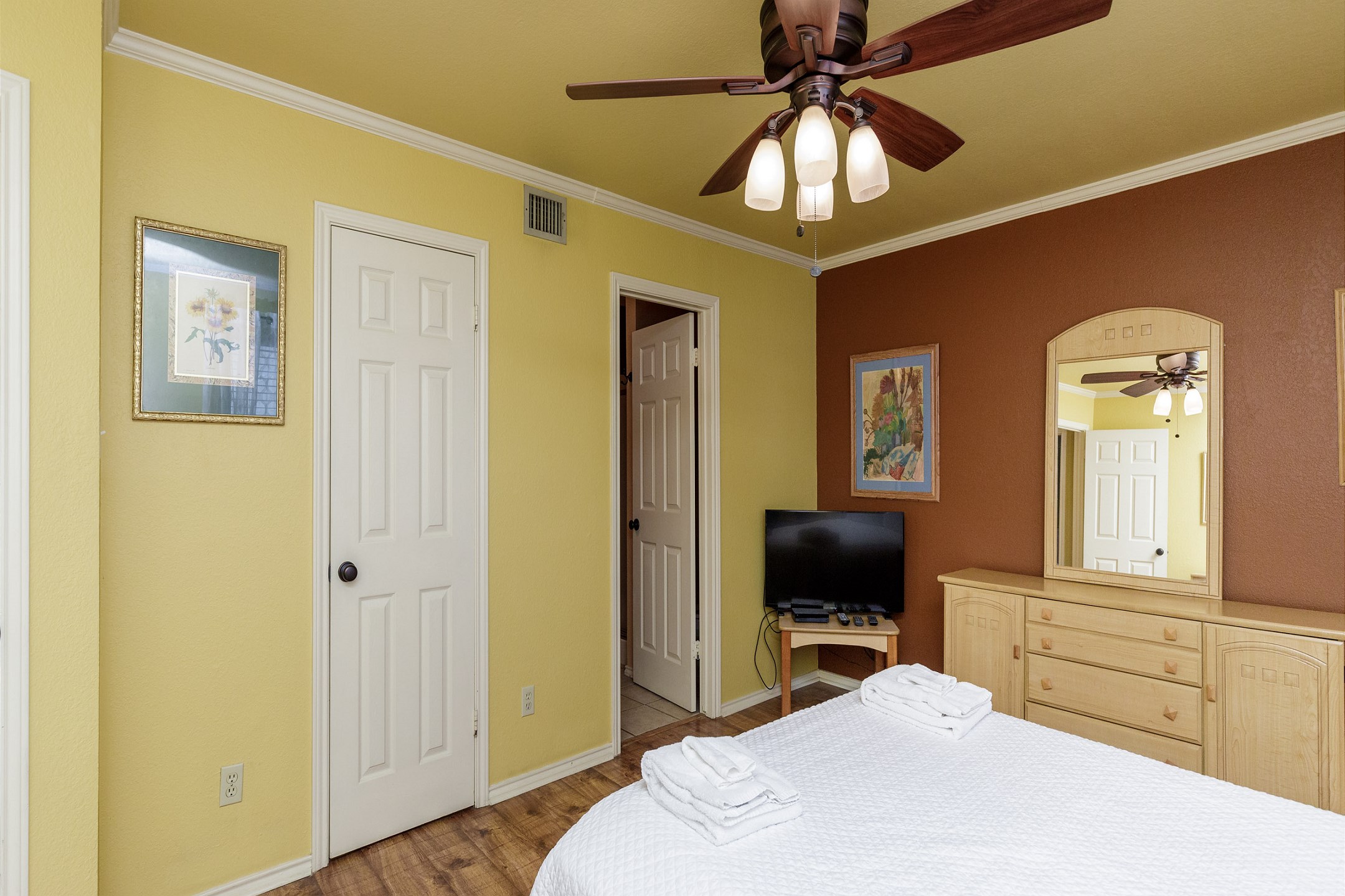 Master bedroom with queen size bed, private bathroom and flat screen TV