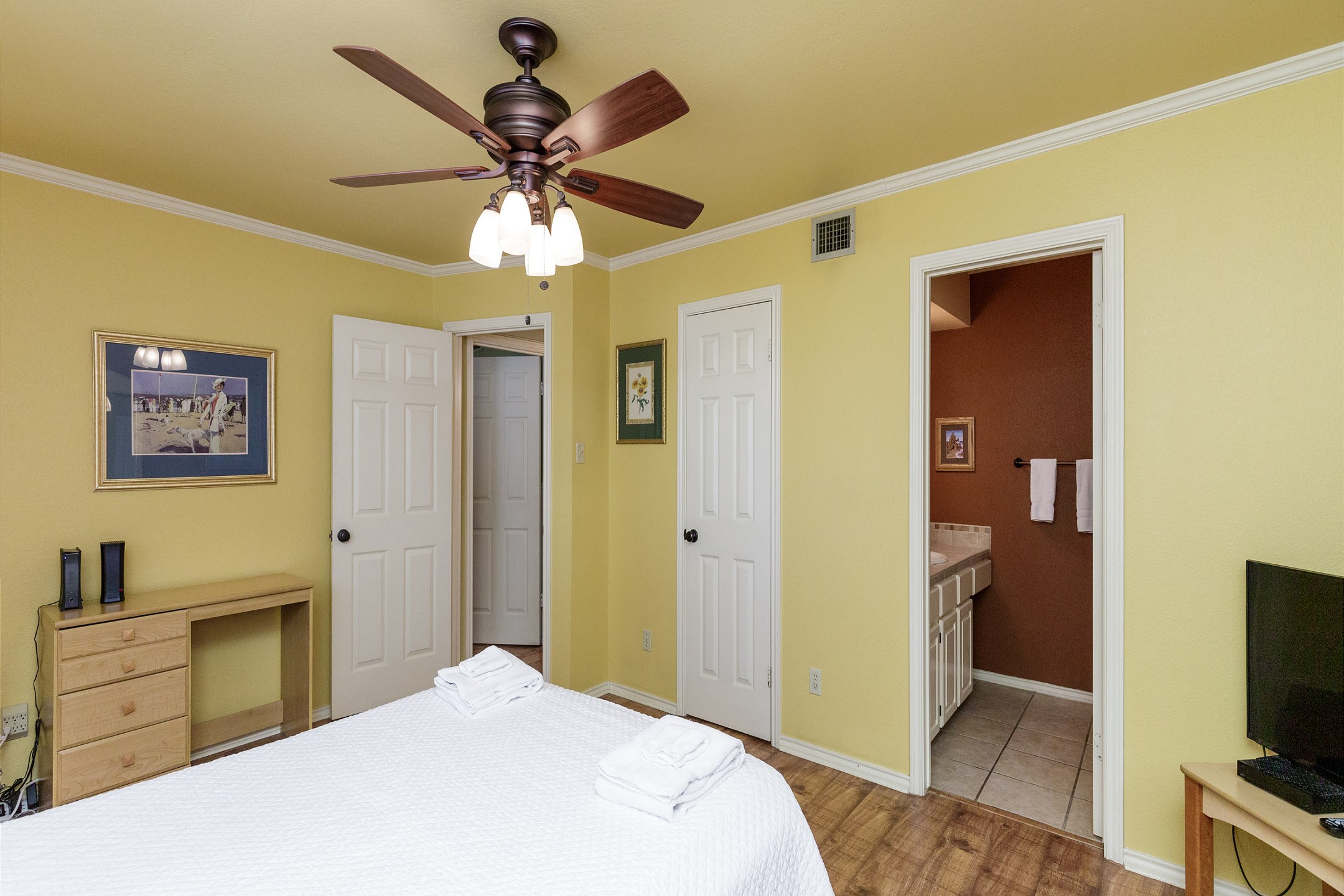 Master bedroom with queen size bed, private bathroom and flat screen TV