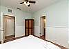 Third bedroom on the first floor with queen size bed, two twin rollaways, private bathroom and private patio 
