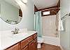 Private bathroom off master suite 2 with tub and shower 