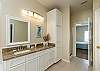 Master bathroom with ample storage, garden tub, and walk in shower 