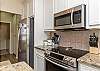 Fully equipped kitchen with updated appliances and ample storage space 