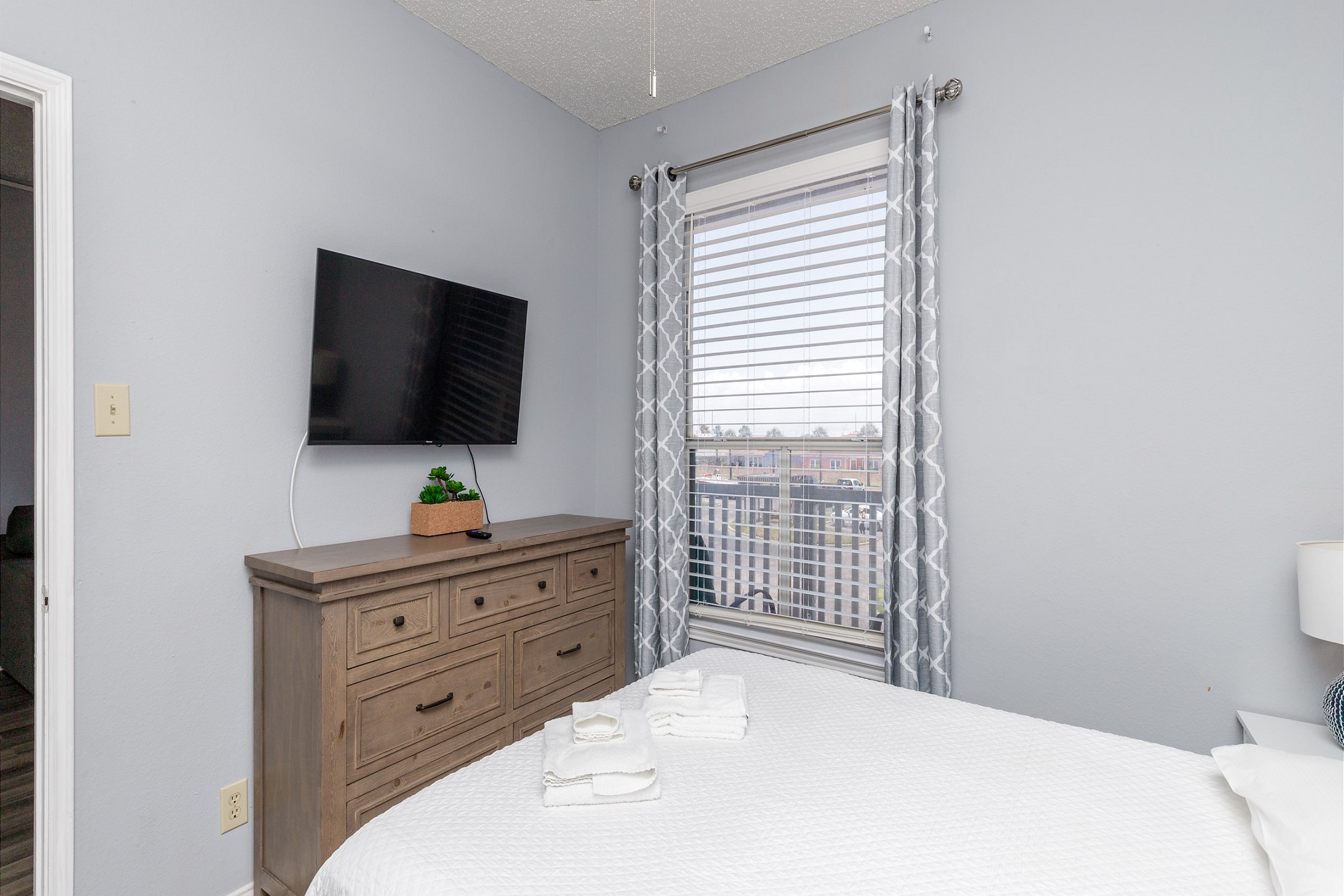 Master bedroom with queen size bed and flat screen TV