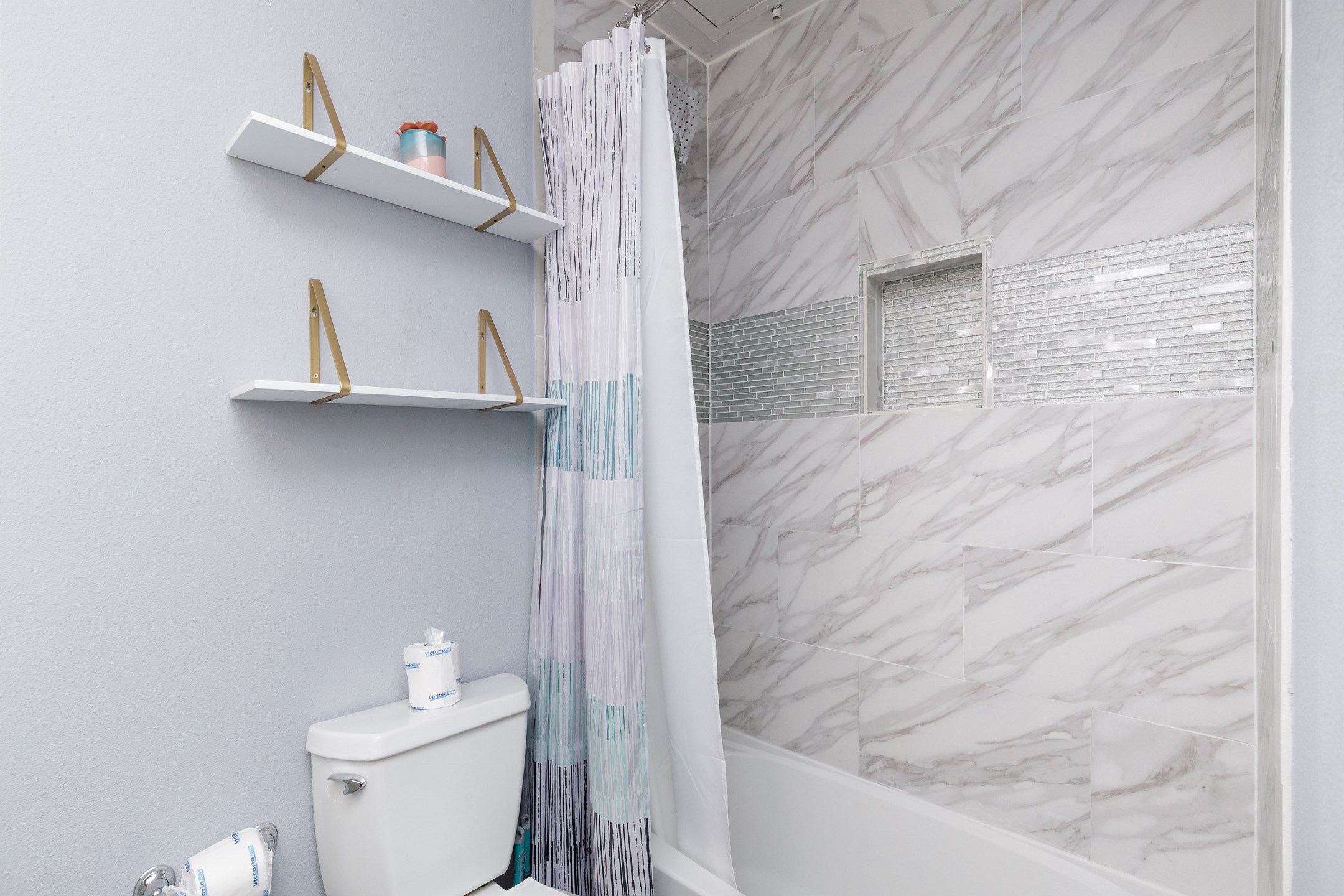 Updated bathroom with tub and shower 