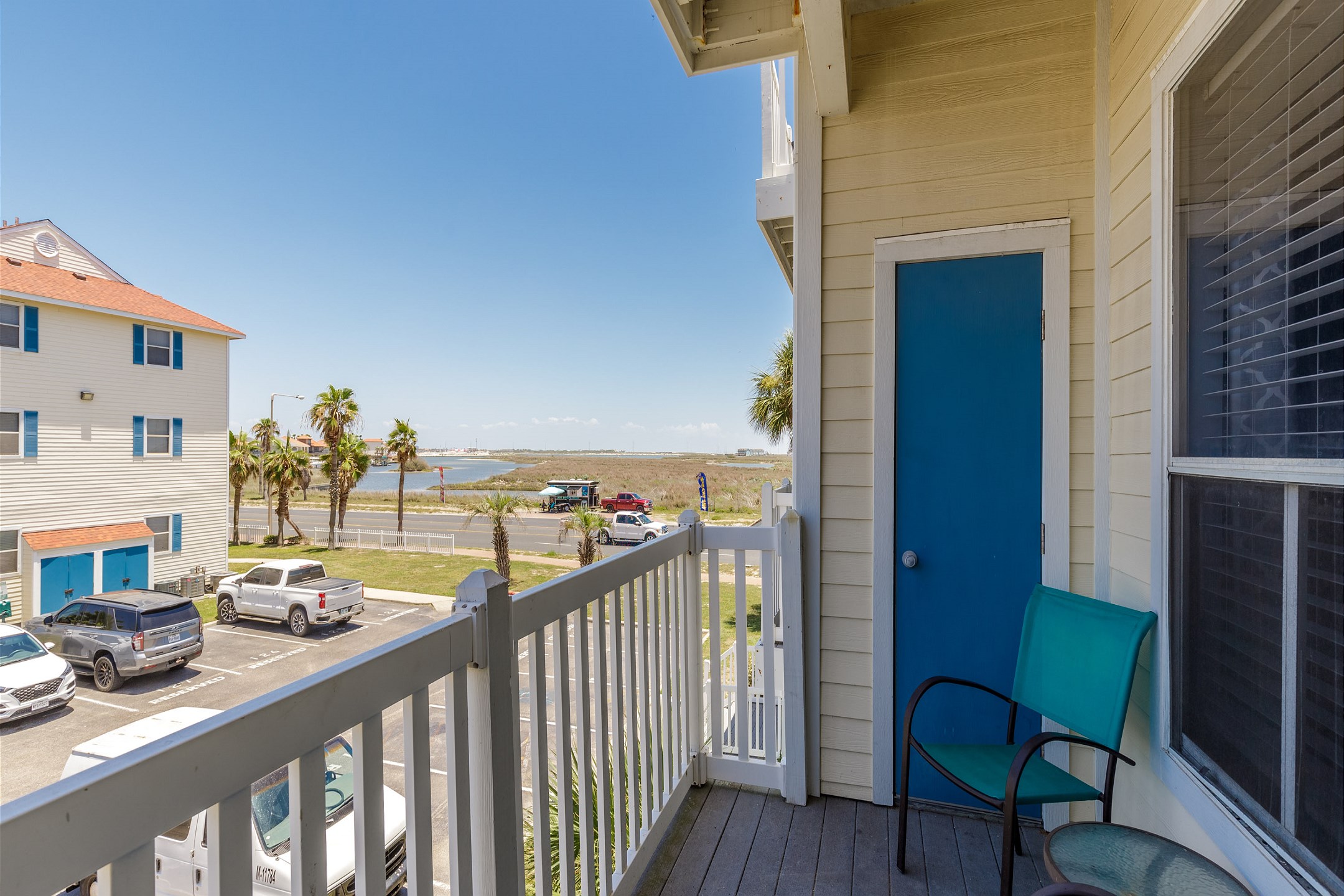 Private balcony on the second floor with table and chairs 