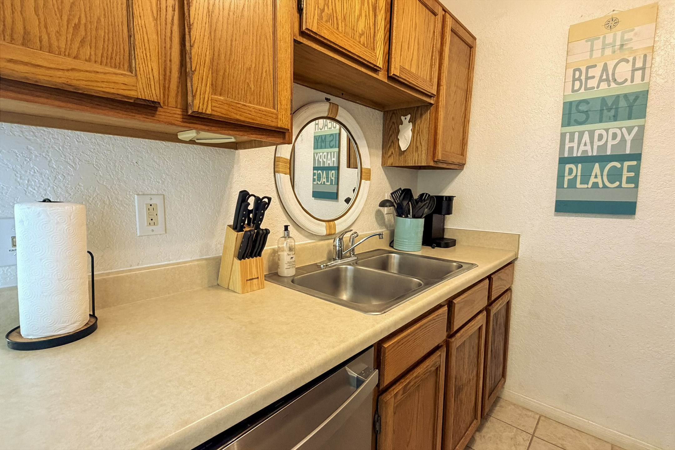 Vacation rental kitchen with full size appliances, dishes, coffee maker and utensils for cooking in 