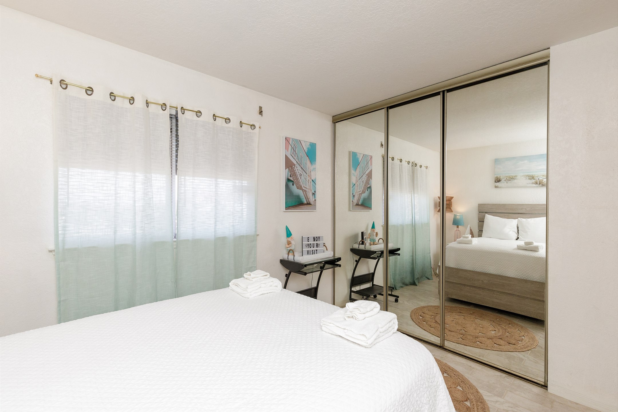 Master bedroom with queen size bed, flat screen TV to enjoy and full length mirrors 