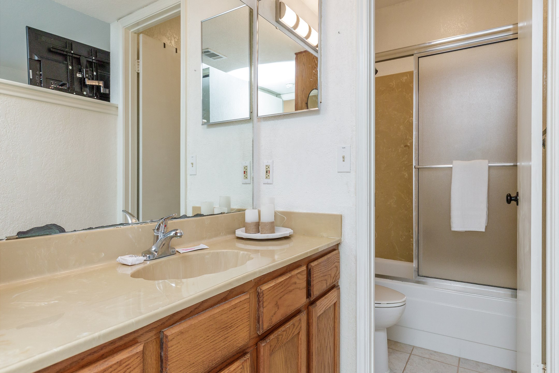 Guest bathroom with separate sink area and tub/shower combo