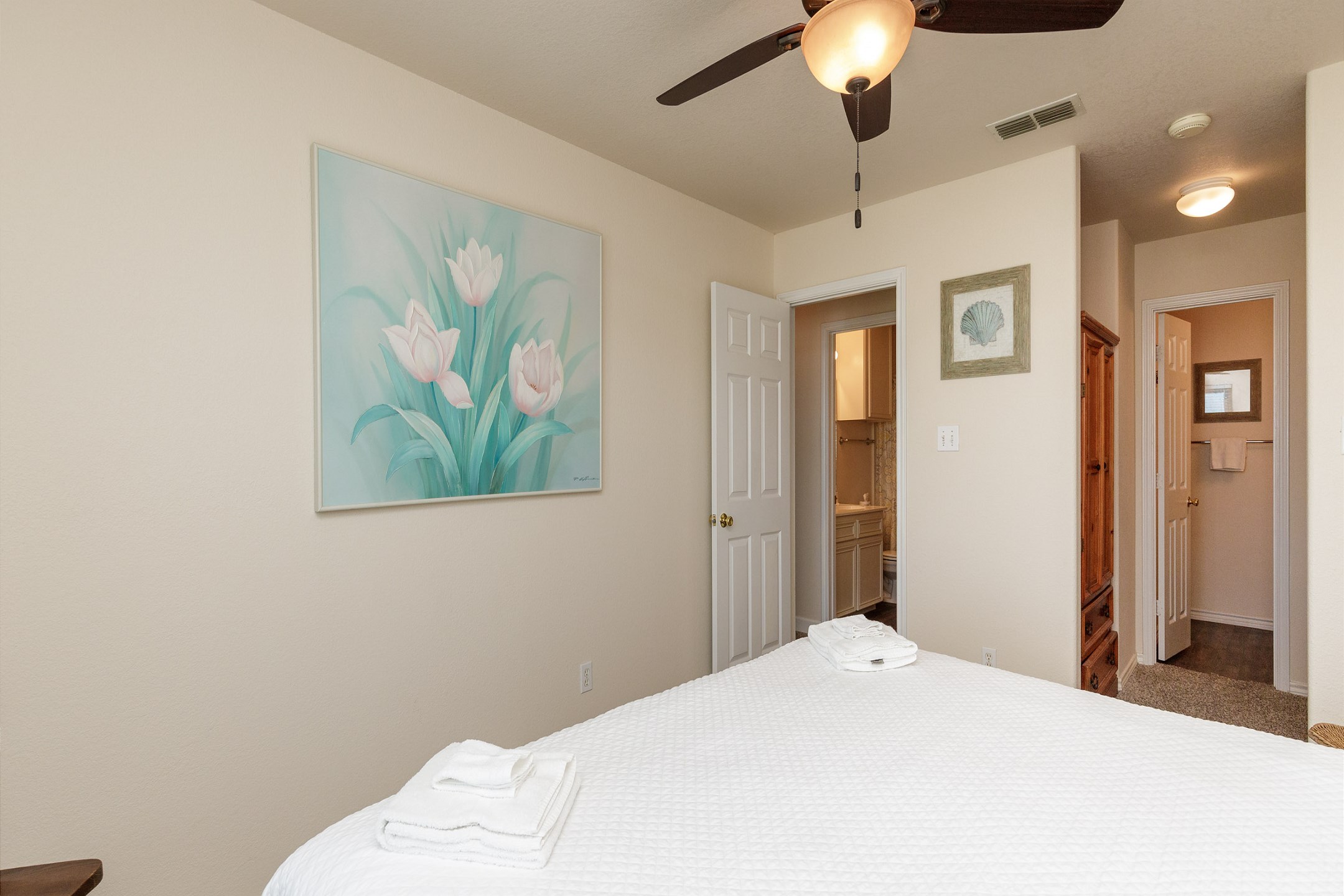 Master bedroom with king size bed, walk in closet and private bathroom 