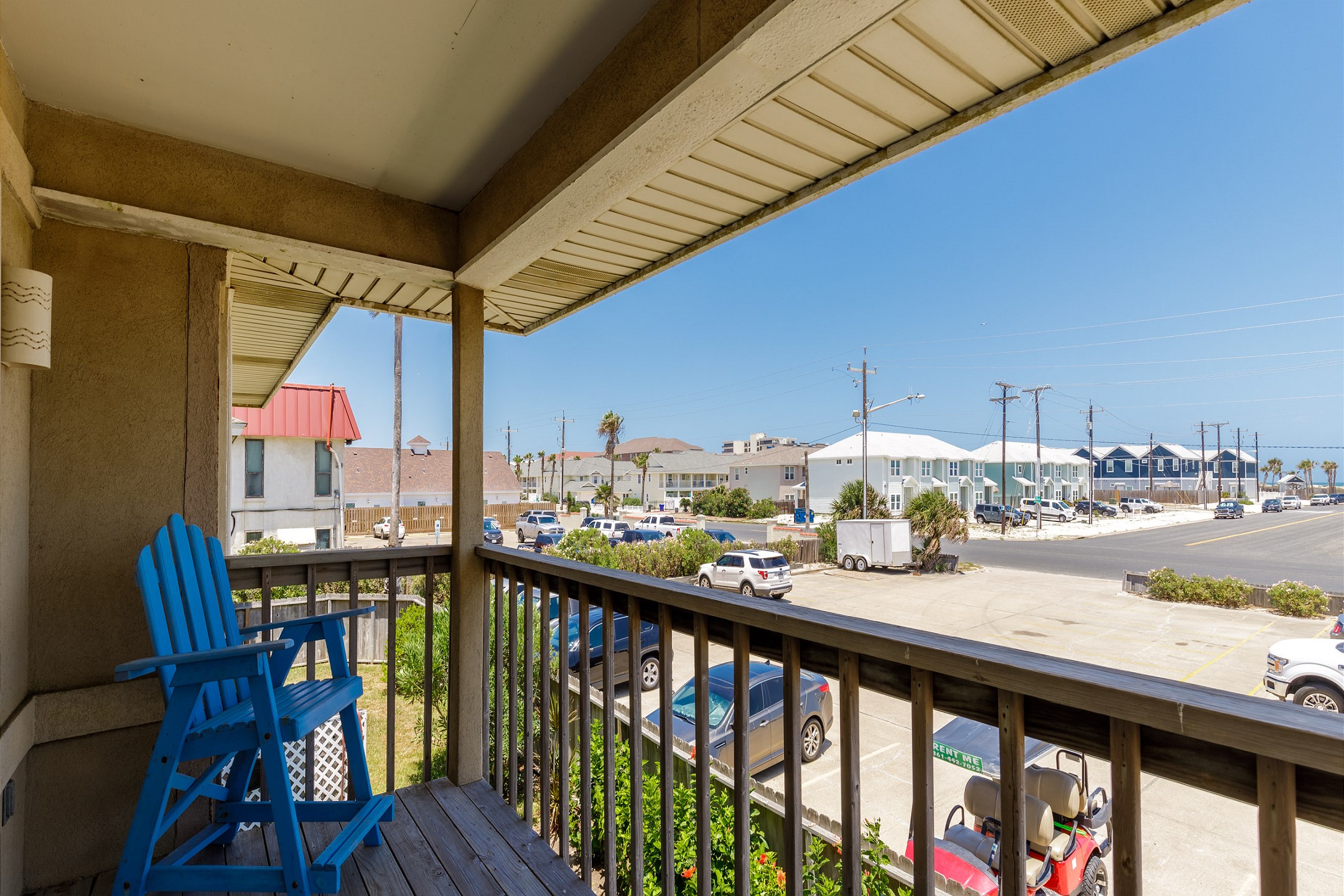 Private balcony off the living area with seating, just down the street from Whitecap Beach