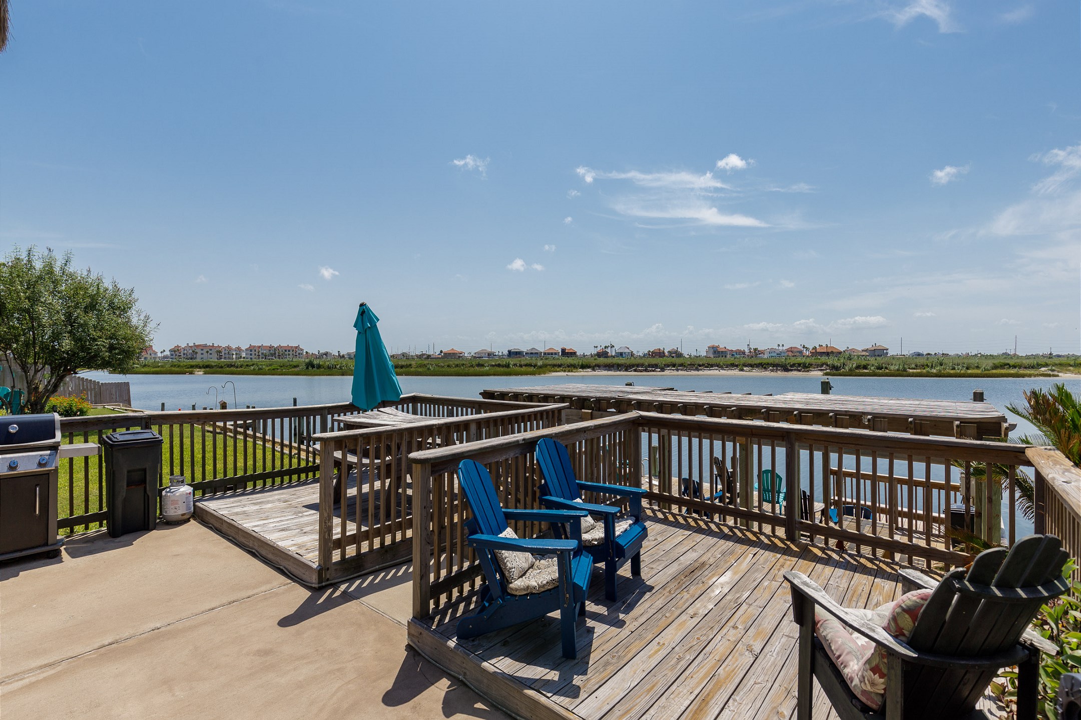 Large deck area with plenty of seating for relaxing and watching the water