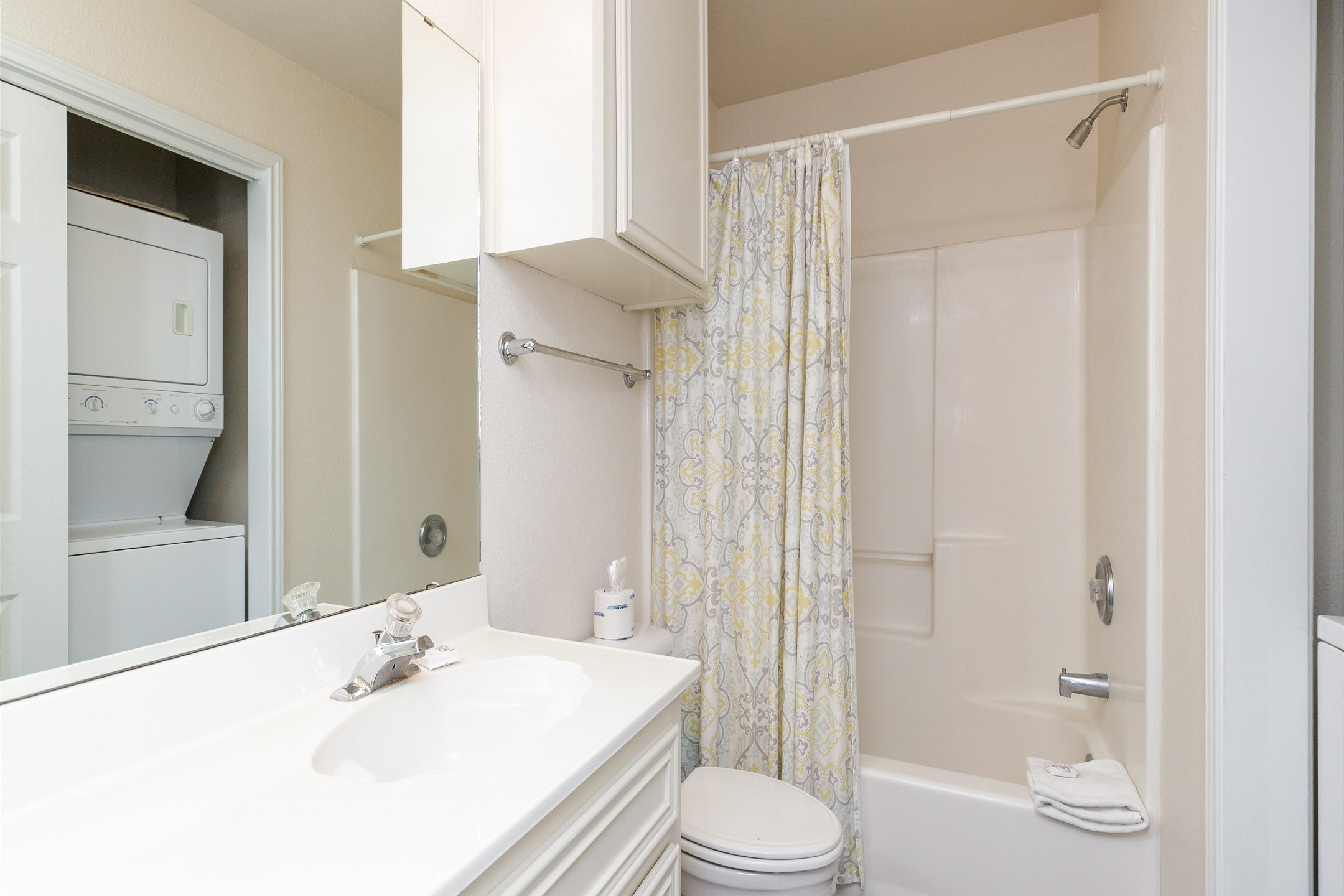 Guest bathroom with tub and shower 