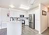 Fully equipped kitchen over looking the dining area with breakfast bar