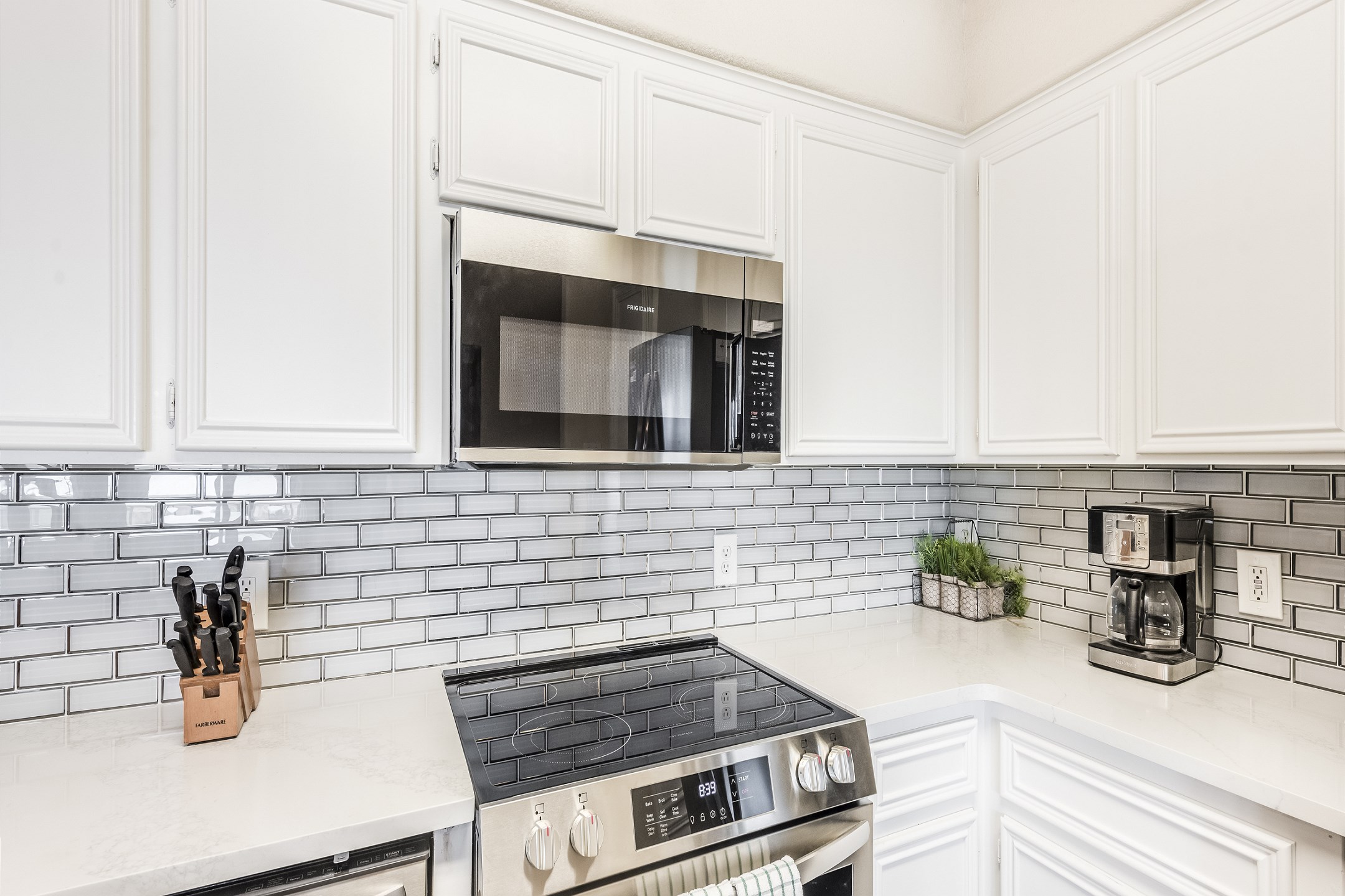Stylish kitchen equipped with stainless steel appliances and abundant space for crafting delicious meals