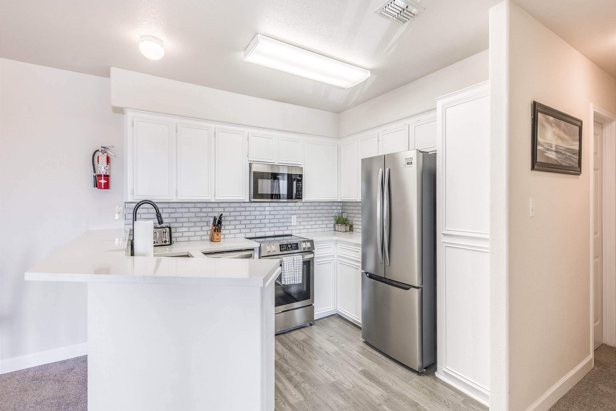 Fully equipped kitchen over looking the dining area with breakfast bar