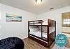 Third bedroom with full over full size bunk bed and twin trundle, along with flat screen TV