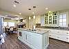 Fully equipped kitchen with beautiful counter tops and ample space to cook