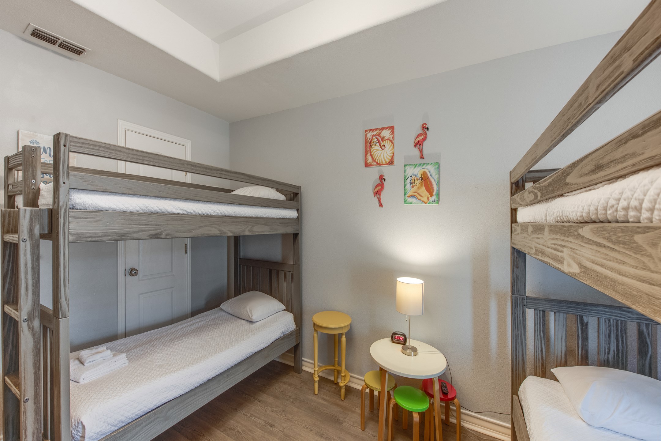 Third bedroom on the second floor with two sets of twin size bunk beds and flat screen TV
