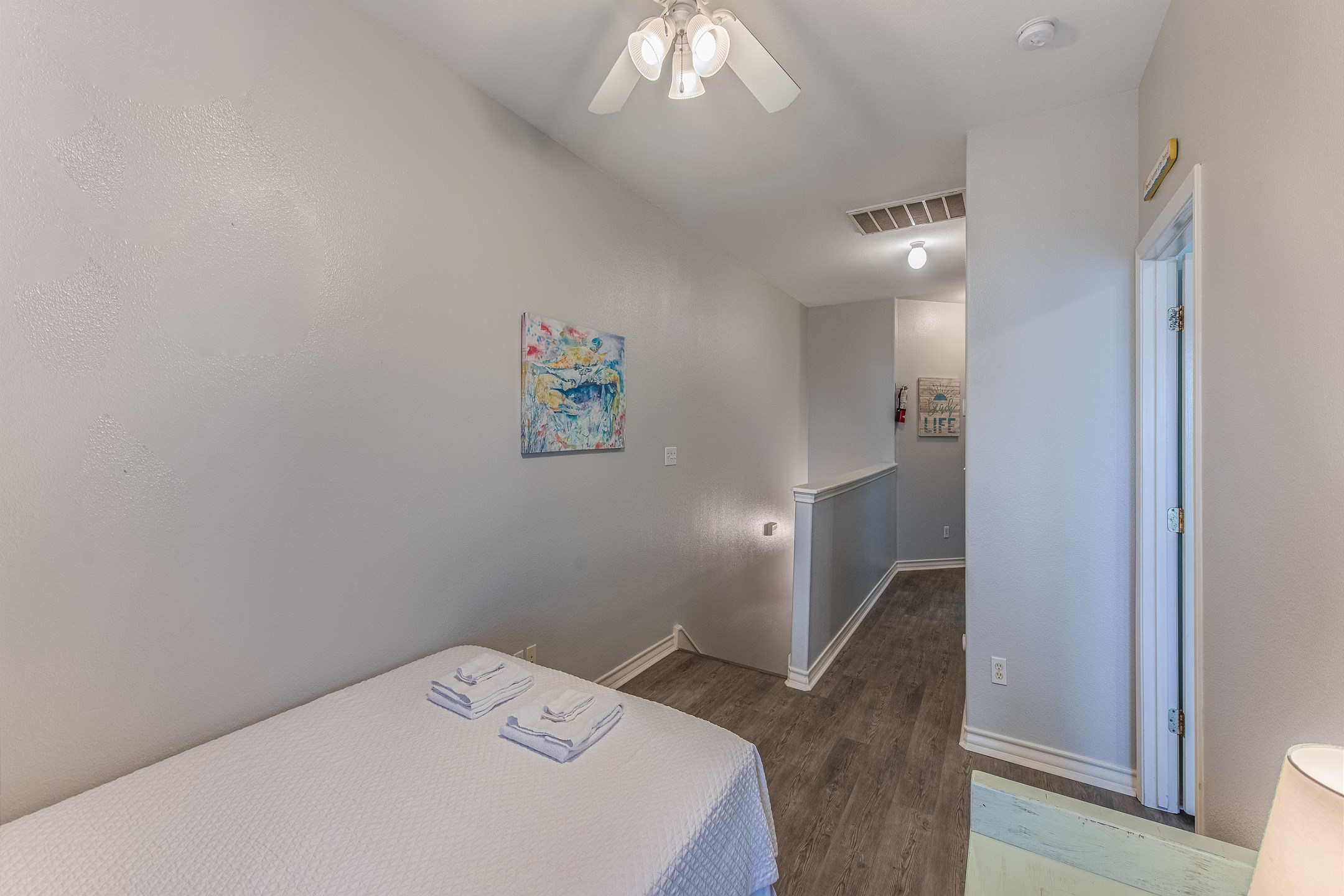 Loft area on the second floor with queen size bed and access to the private balcony 