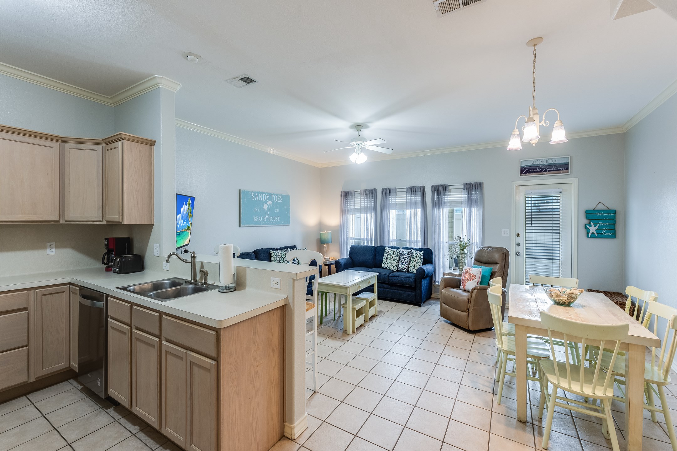 Lovely living, dining and kitchen area with access to the private patio