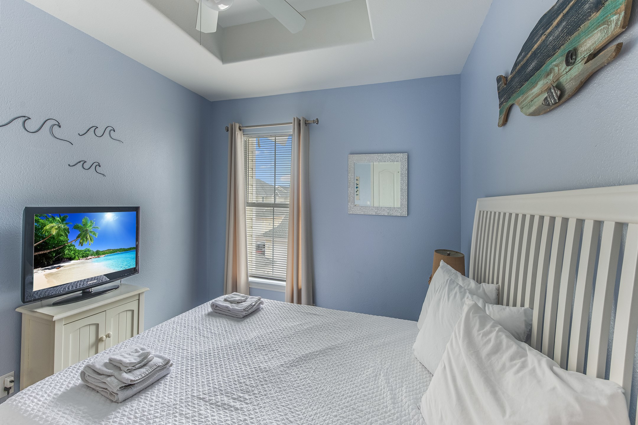 Second bedroom on the second floor with queen size bed and flat screen TV
