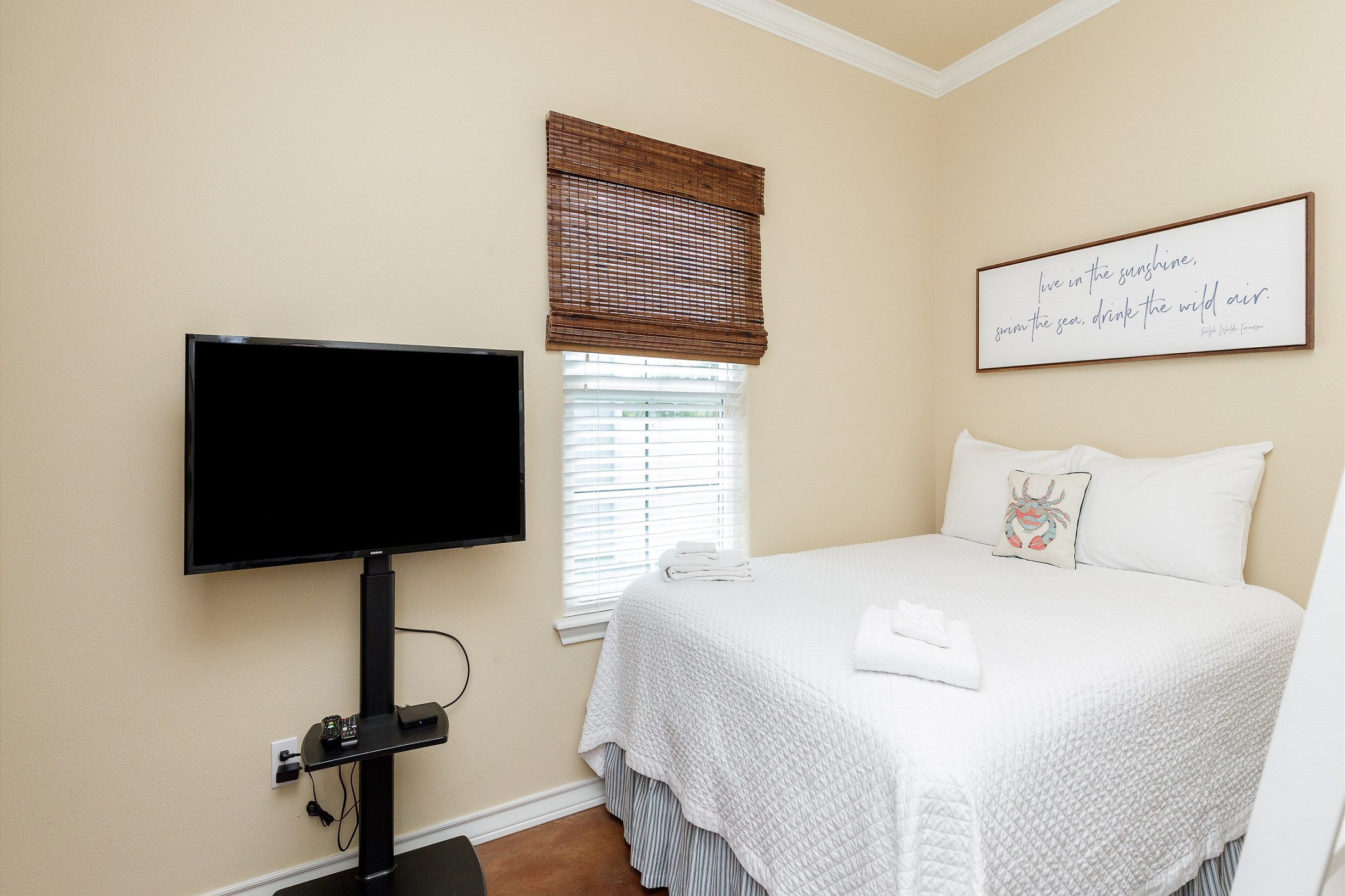 Second bedroom with queen bed and twin over twin bunk beds with flat screen TV