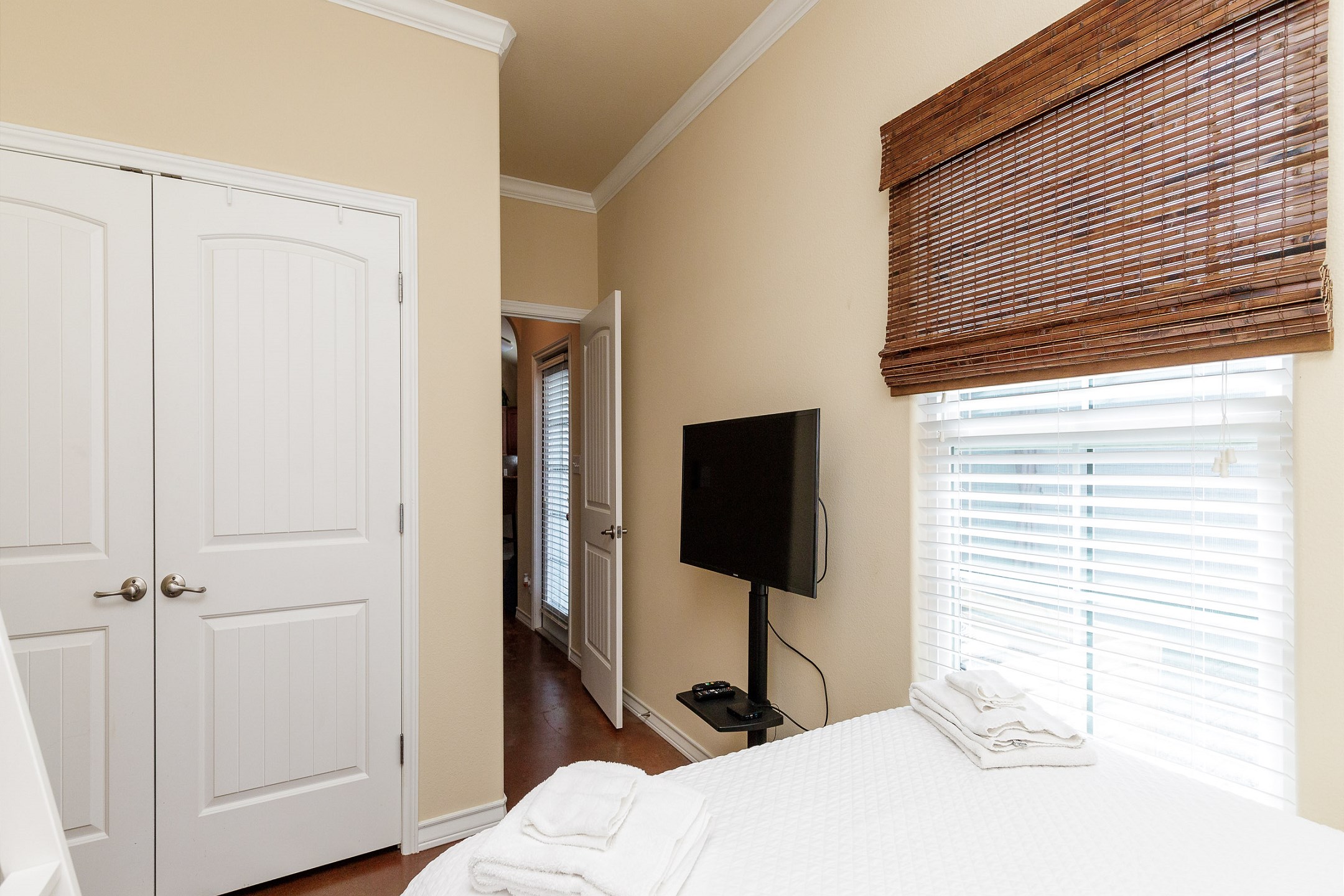 Guests staying in the second bedroom will enjoy a queen size bed, twin bunk beds, and TV