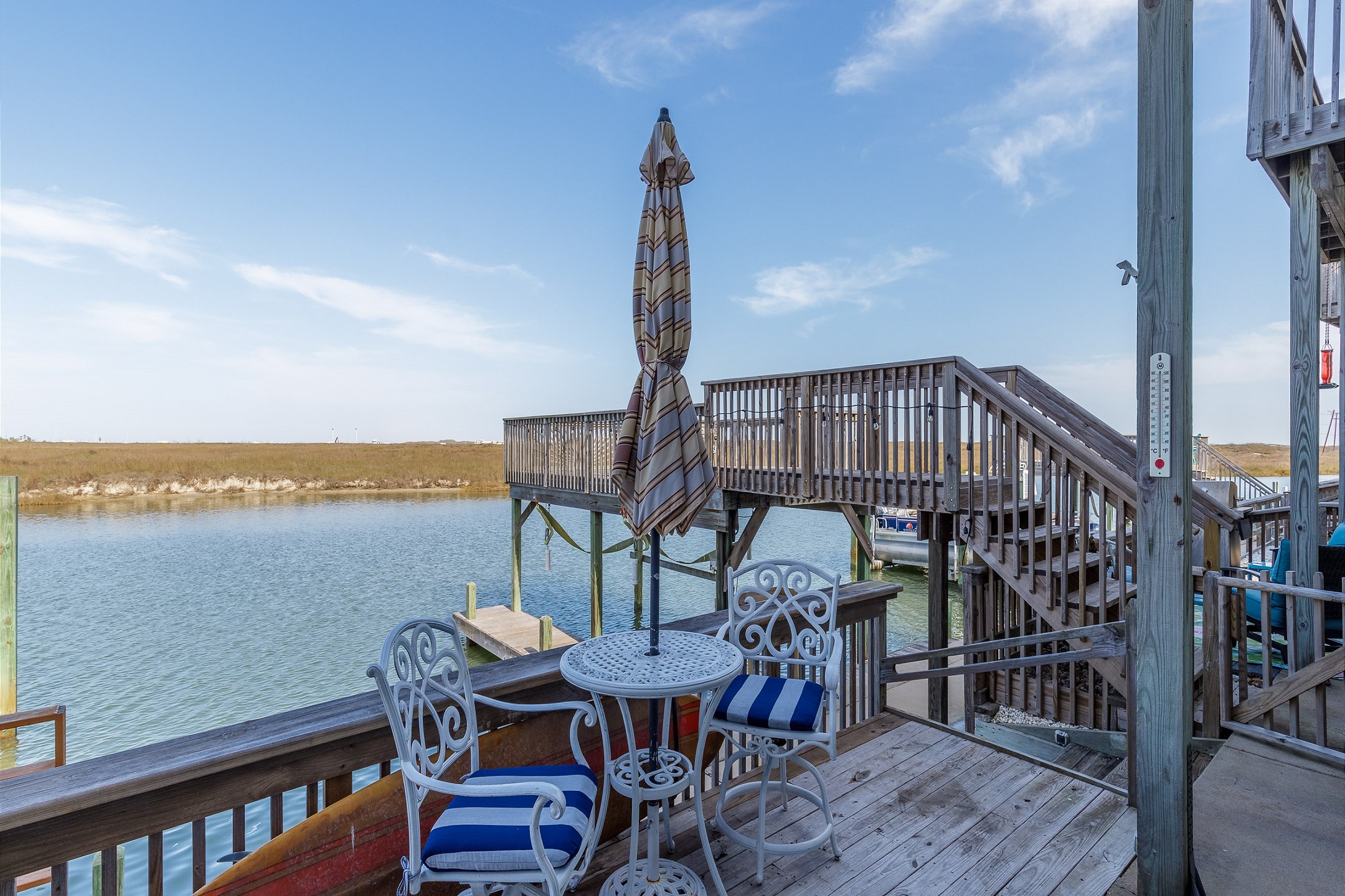 Private patio with comfy chairs that over looks the canal waters - great place to unwind from the everyday life