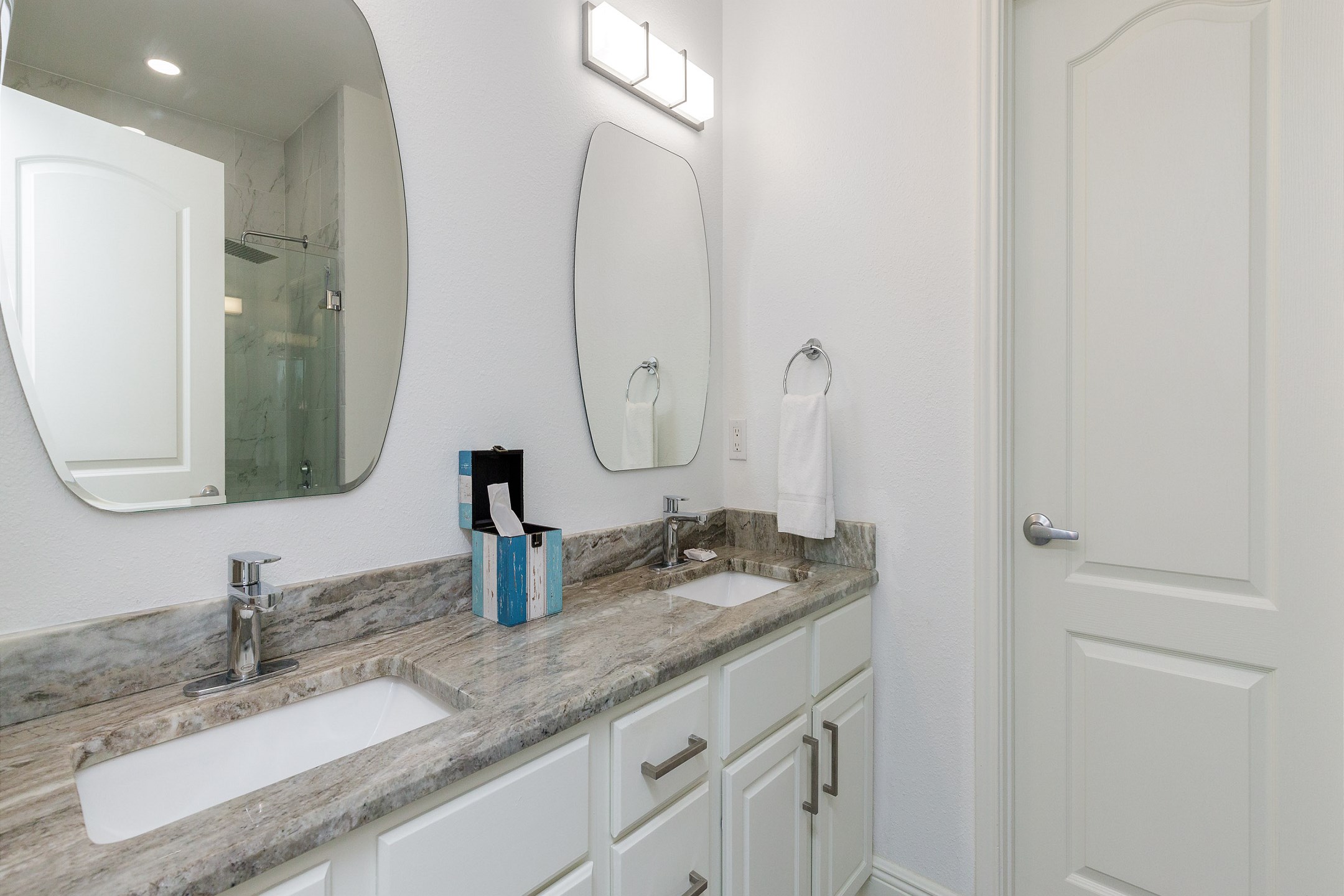 Master bathroom with double sinks and walk in shower 