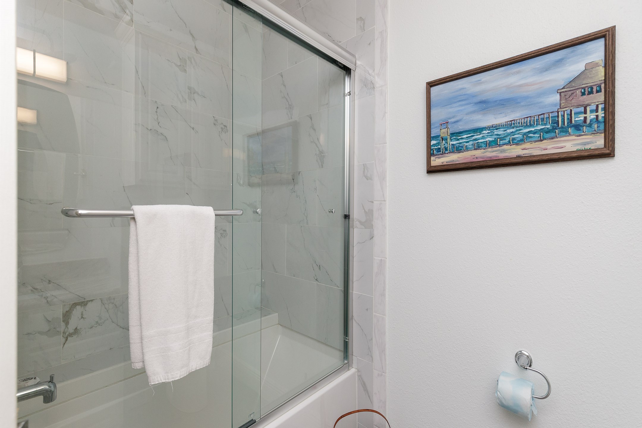 Guest bathroom on the second floor with tub and shower 