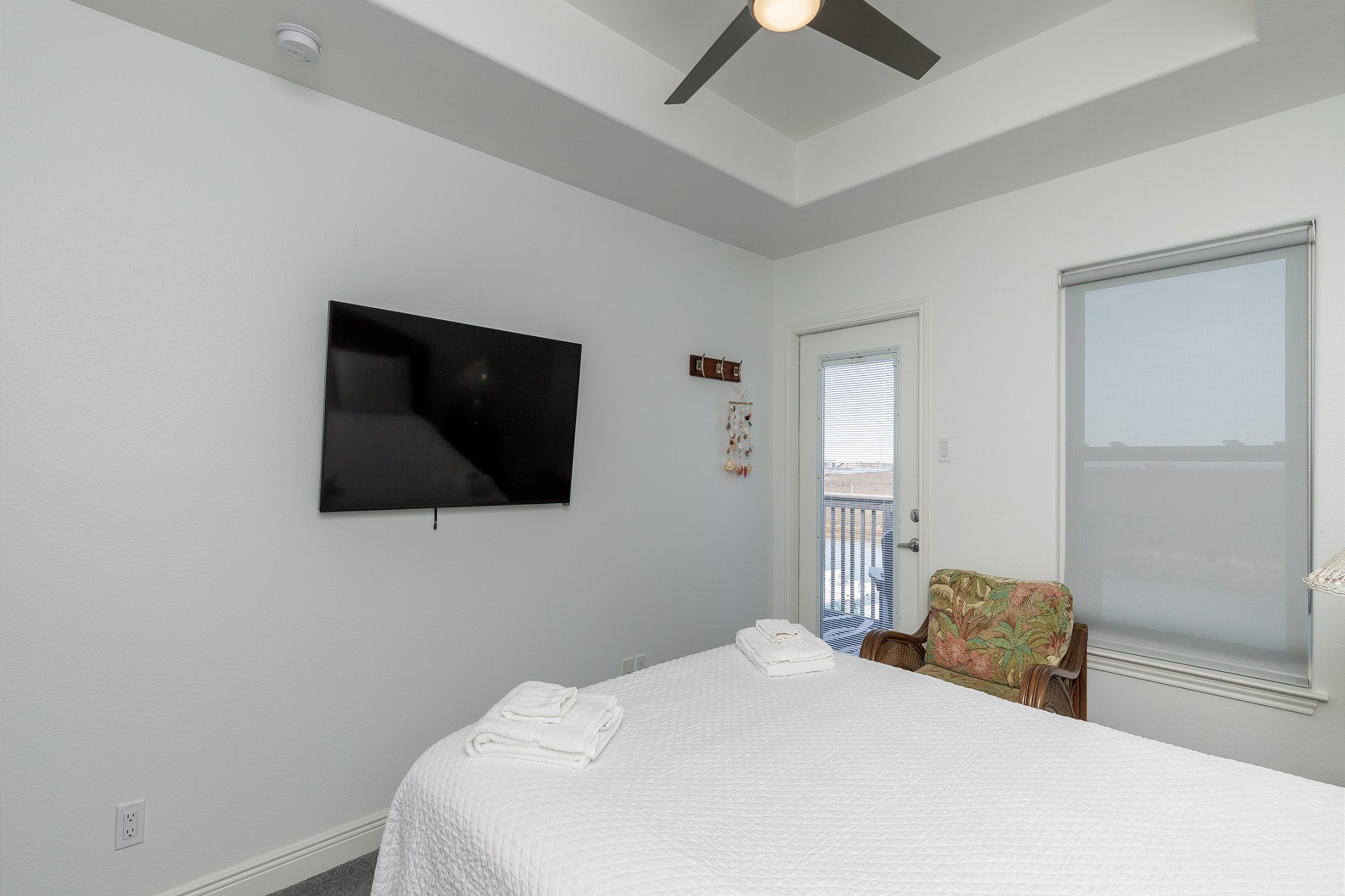 Second bedroom on the second floor with queen size bed, private balcony and flat screen TV