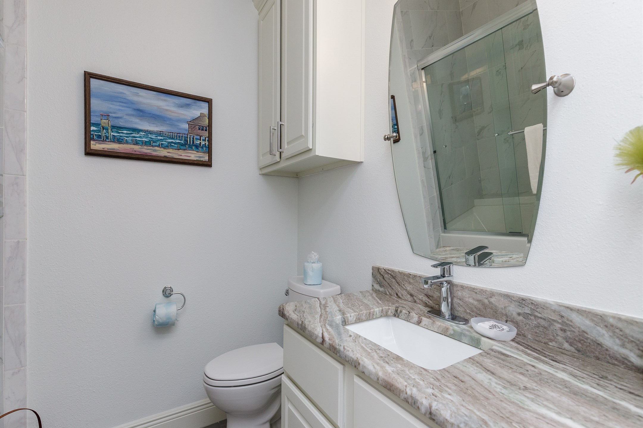 Guest bathroom on the second floor with tub and shower 