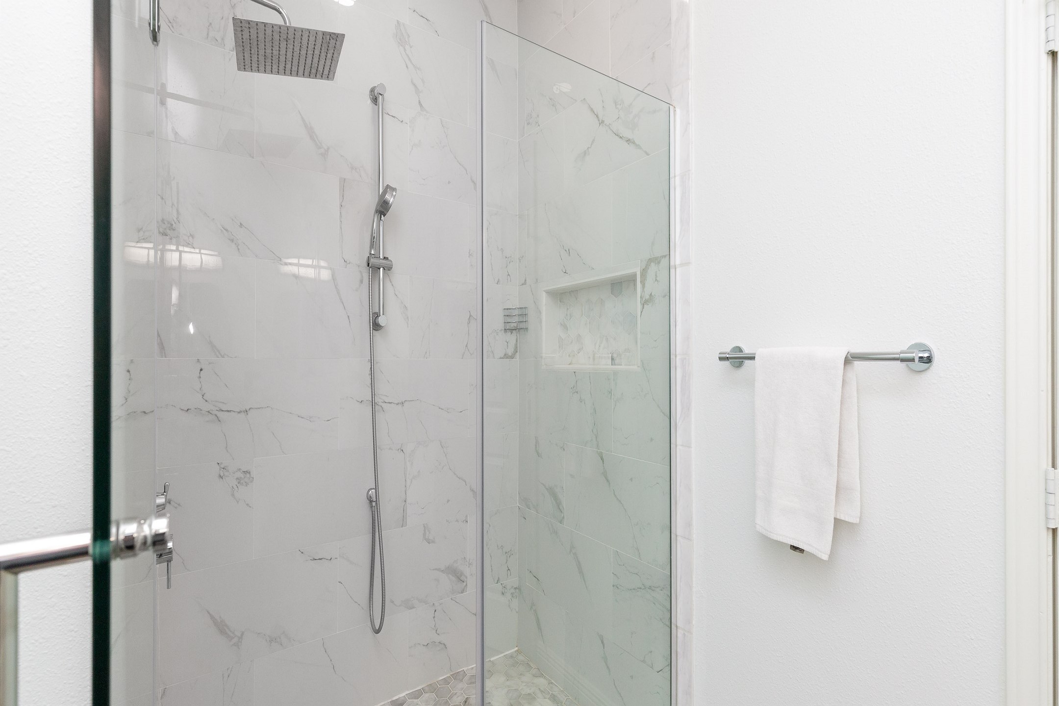Master bathroom with double sinks and walk in shower 