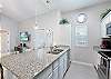 Fully equipped kitchen with stainless steel appliances and beautiful counter tops