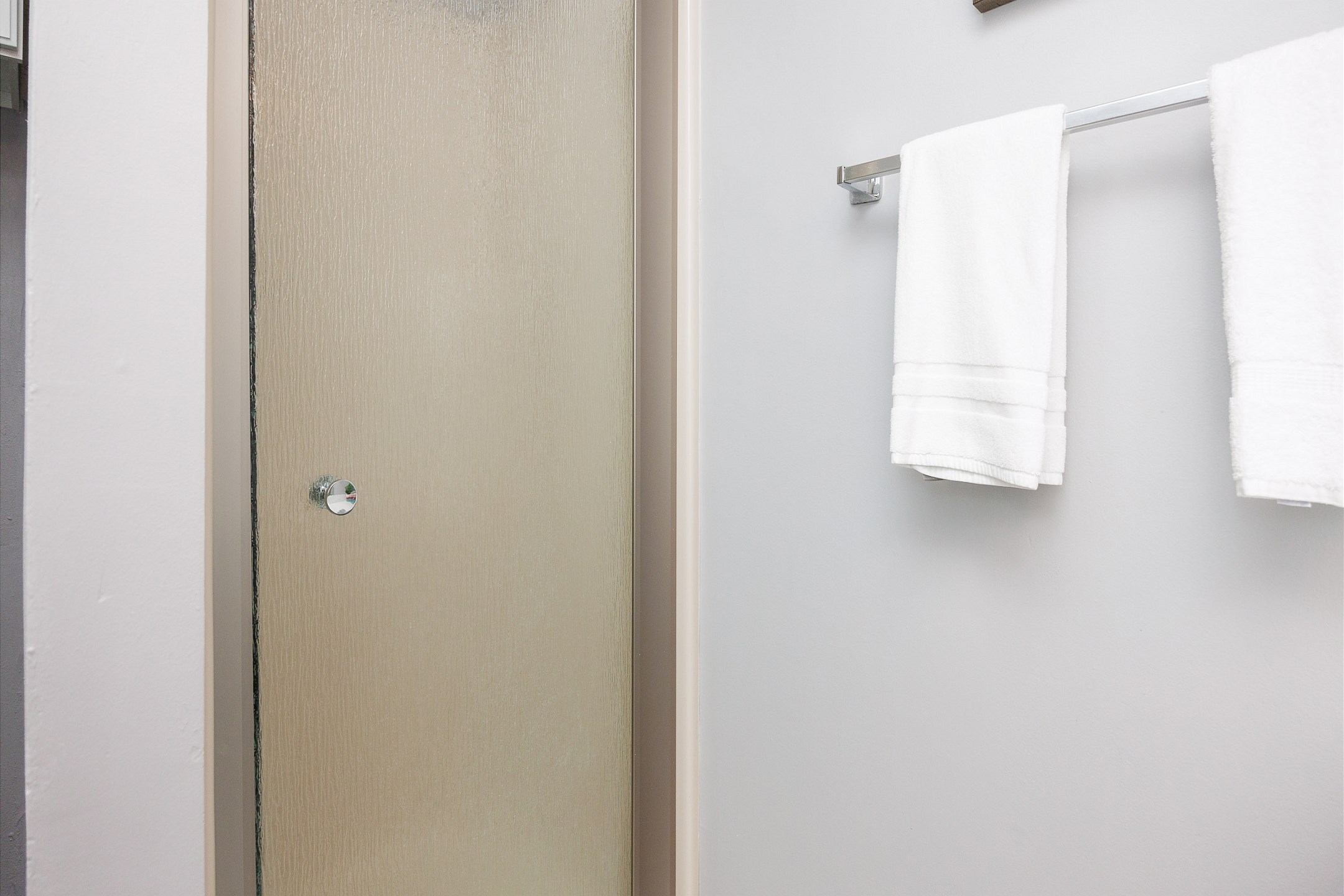 Master bathroom with single sink and walk in shower