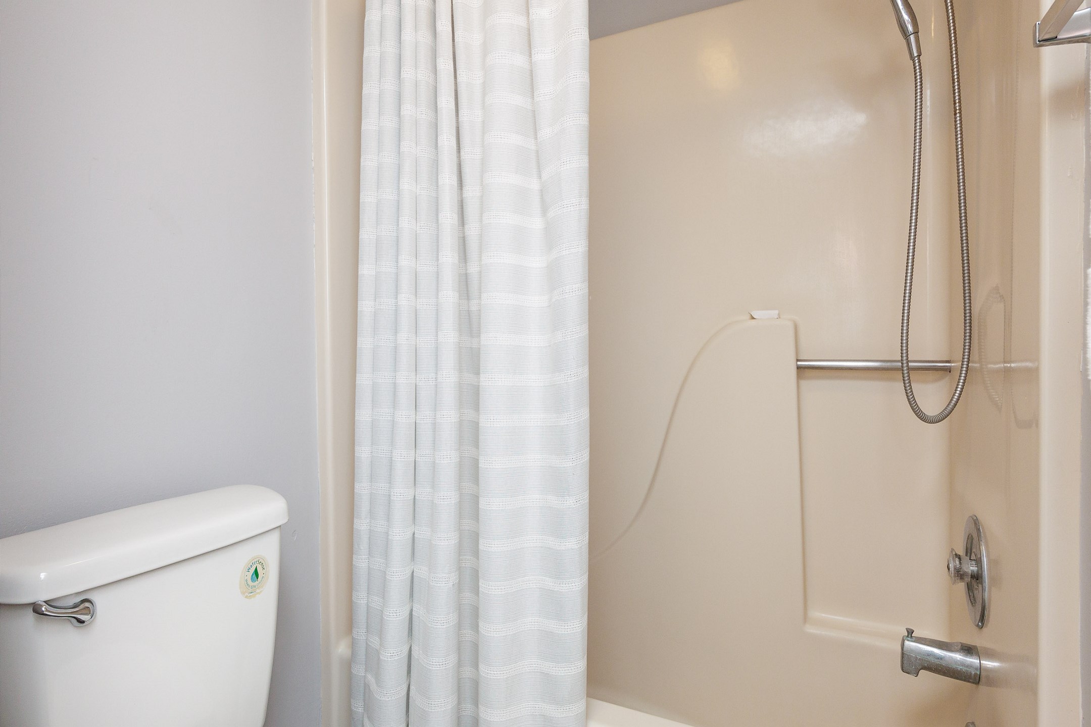 Guest bathroom with single sink and tub/shower combo 