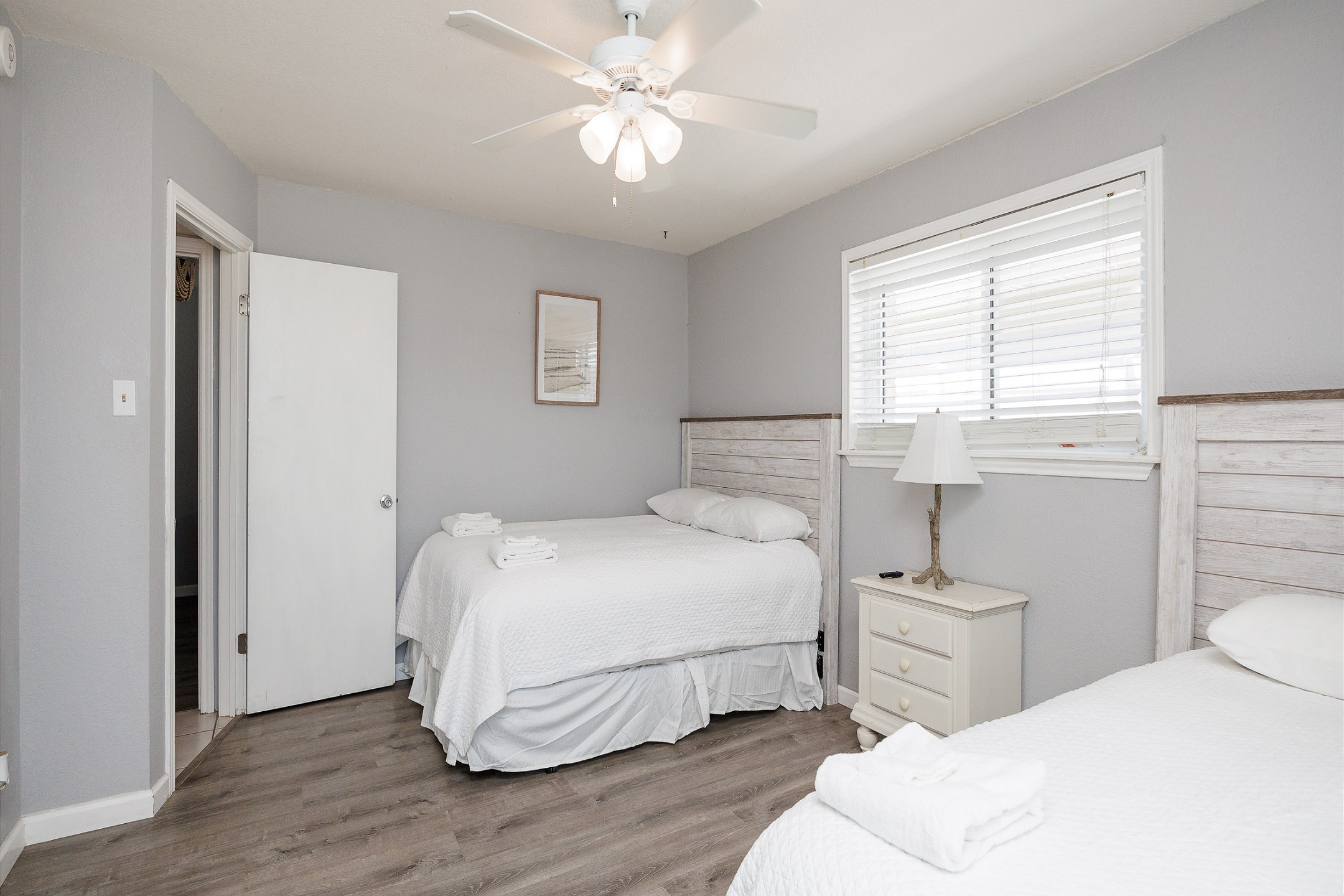 Master bedroom with queen and full size bed, private bathroom and flat screen TV 