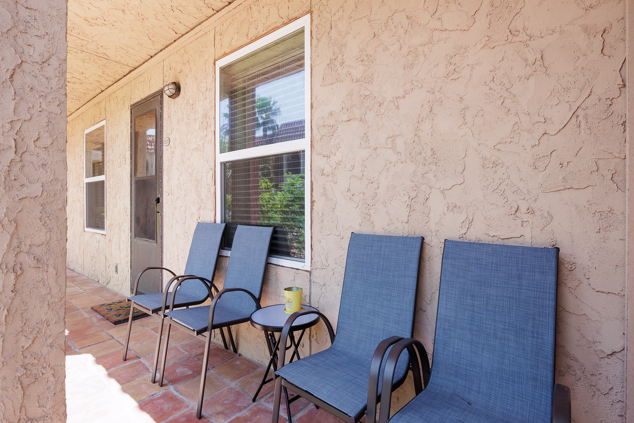 Front entrance to property with seating for outdoor entertaining 