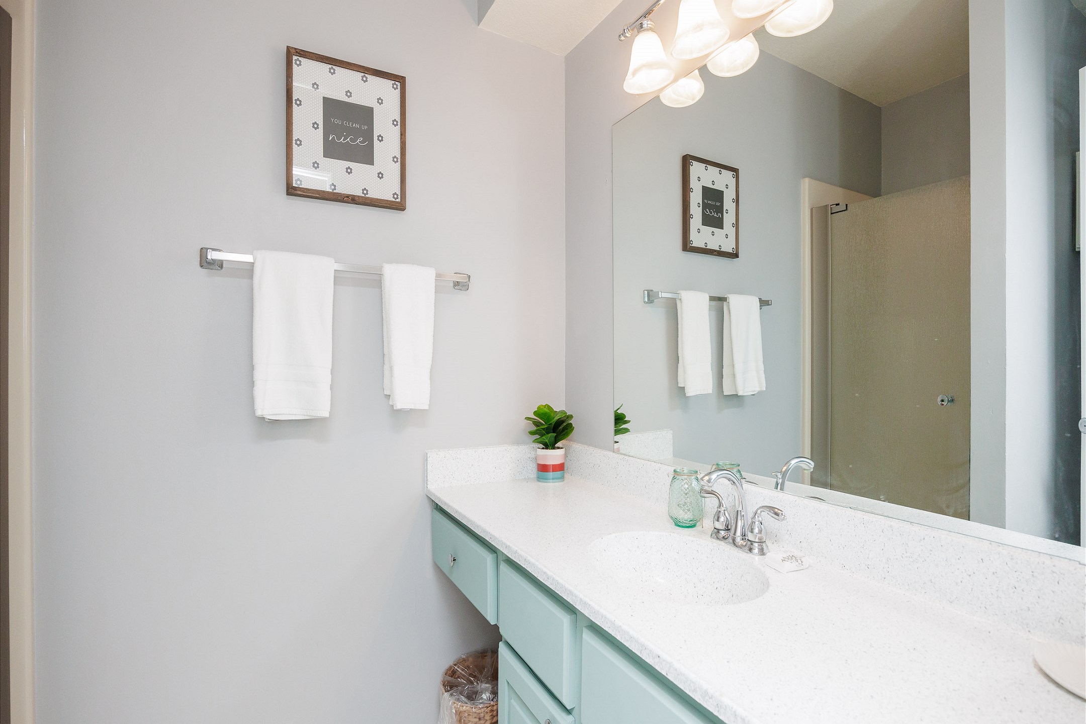 Master bathroom with single sink and walk in shower