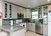 Fully equipped kitchen with beautiful back splash and updated counter tops