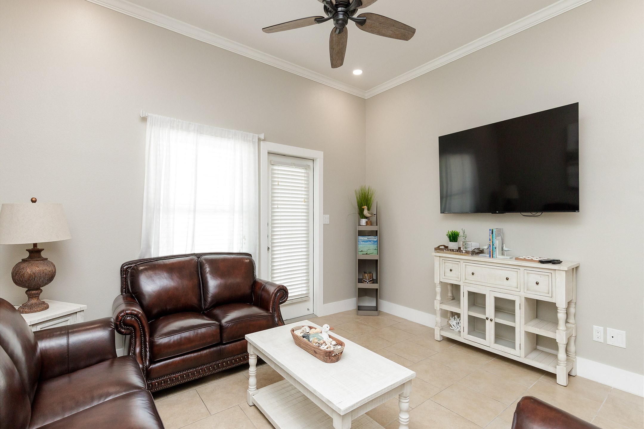 Lovely living space with bright light shining in and flat screen TV to enjoy