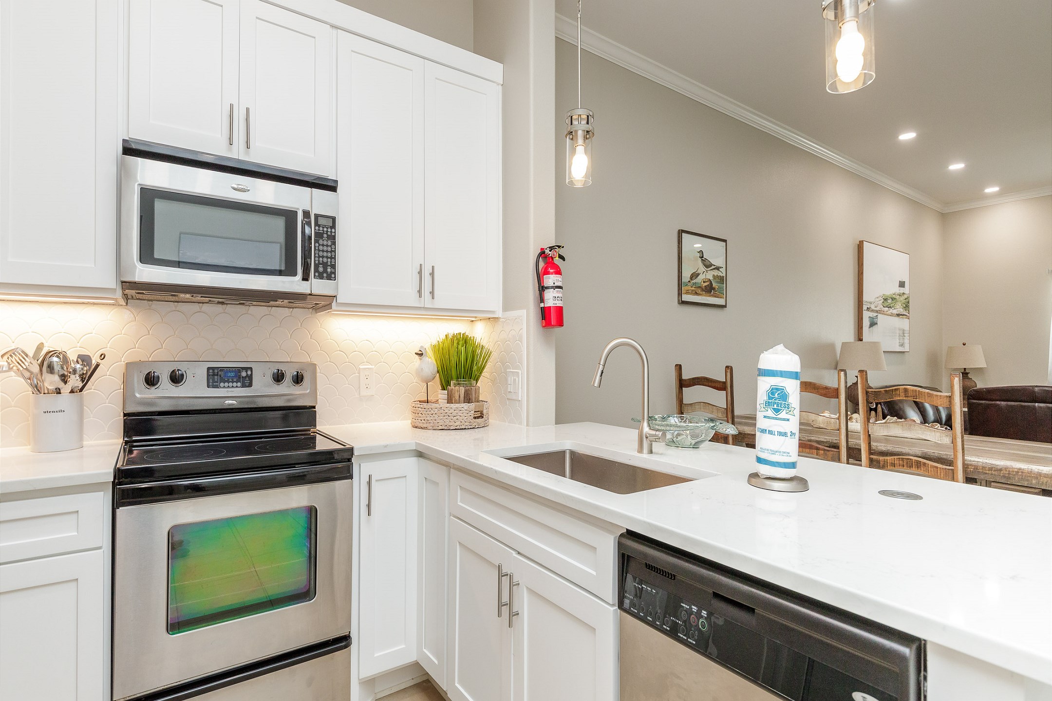 Fully equipped kitchen with stainless steel appliances and updated counter tops 