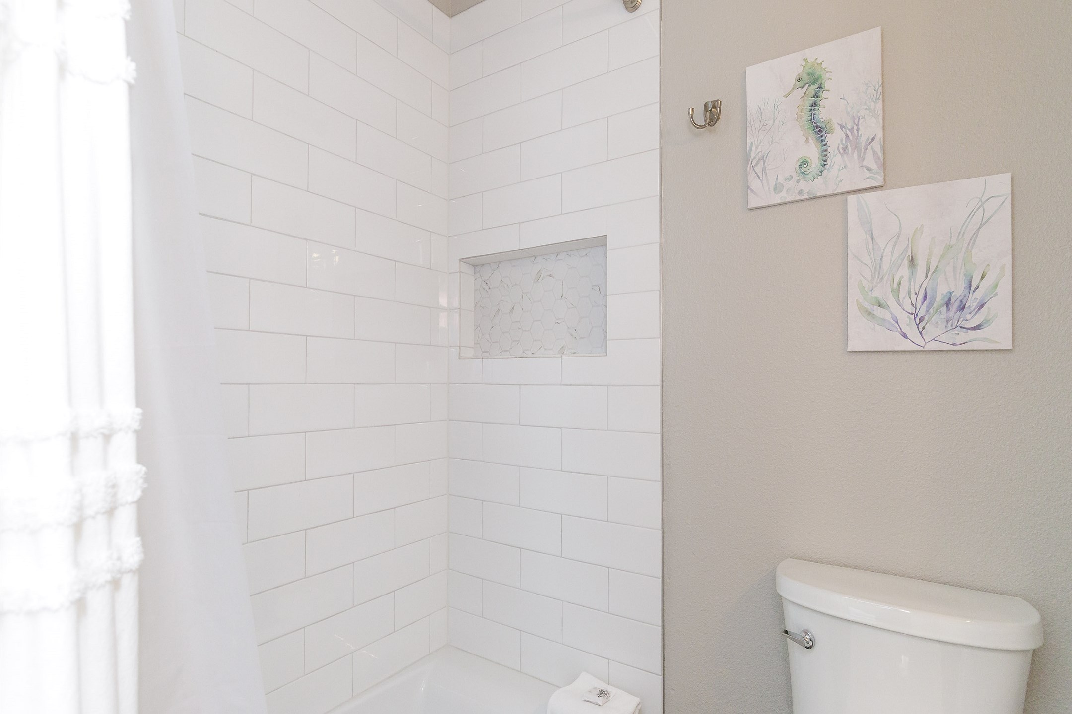 Guest bathroom on the second floor with tub and shower 