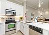 Fully equipped kitchen with stainless steel appliances and updated counter tops 