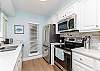 Fully equipped kitchen with stainless steel appliances and plenty of storage 