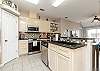 Fully equipped kitchen with stainless steel appliances and plenty of storage space 