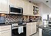 Fully equipped kitchen with stainless steel appliances and lovely counter tops