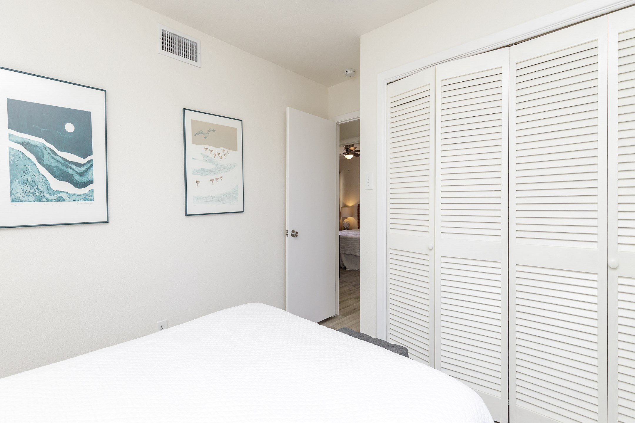 Second bedroom with queen size bed and shared access to the patio space